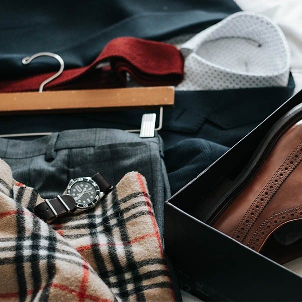Luxury brand clothing laid out with shoes as an outfit  