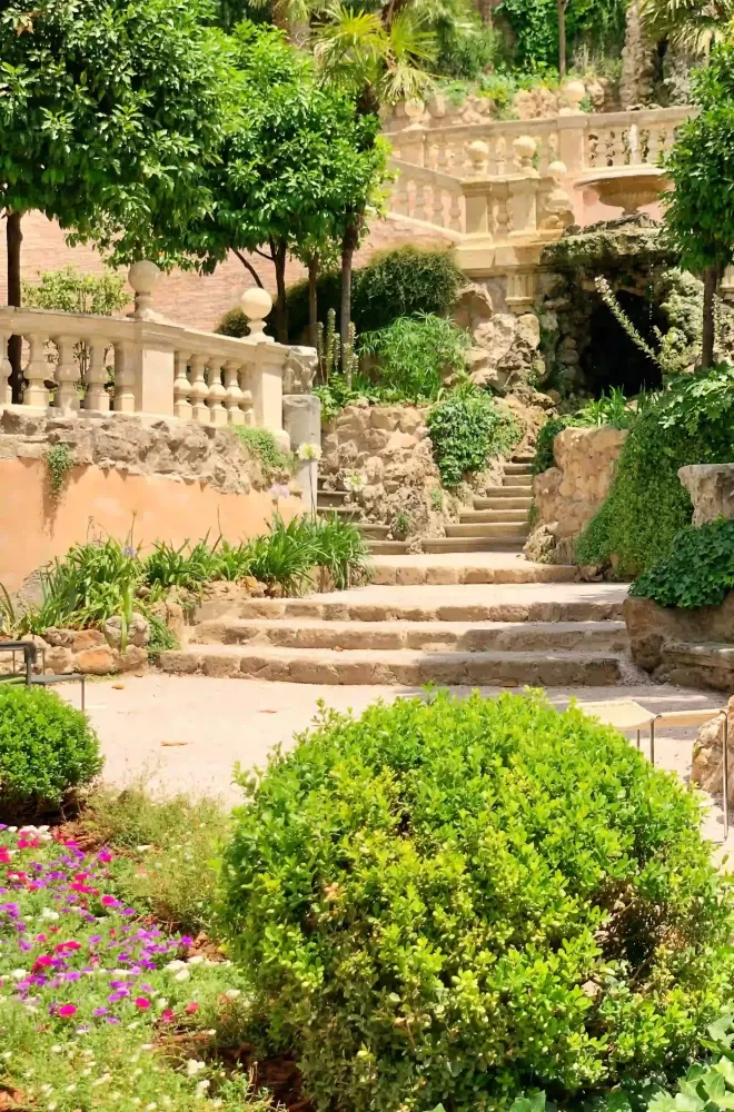 White cobbles staircase and vintage style thick railings travelling up the garden of Hotel de Russie